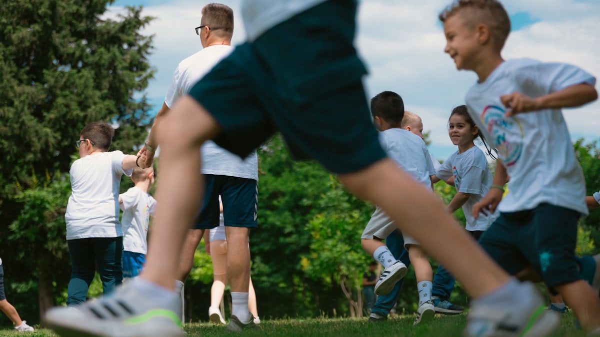 a group of young people playing a game of frisbee